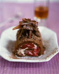 Chocolate sponge roulade filled with raspberry cream