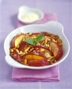 Sweet nectarine gratin with pine nuts