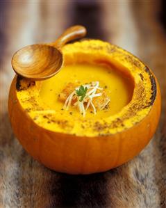 Cream of pumpkin soup in hollowed-out pumpkin