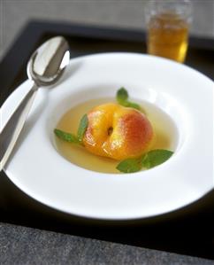 Poached peach in white wine