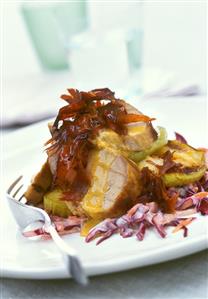 Pork fillet with Parma ham and apples on raw vegetable salad