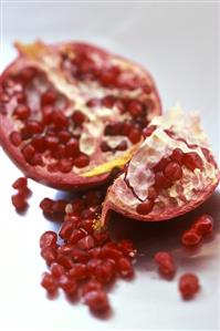 Pomegranate, cut open, and pomegranate seeds