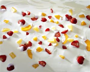 Yoghurt with pieces of fresh strawberry and fruit