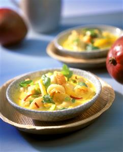 Fish soup with coconut milk, mango and leeks