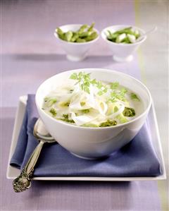 Asparagus soup with strips of asparagus and pesto