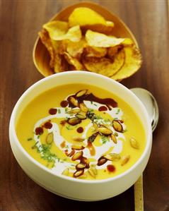 Pumpkin soup with pumpkin seeds, potato crisps behind (1)