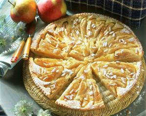 Apple tart with pine nuts, a piece cut