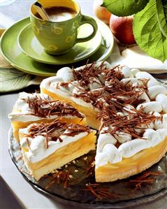 Apple sponge cake with cream icing and chocolate curls