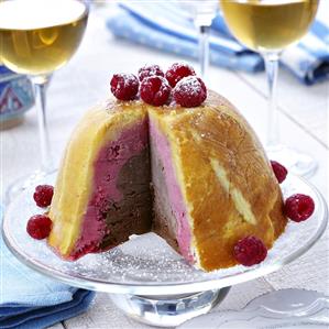 Chocolate and raspberry iced bombe, a piece cut