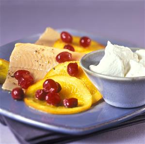 Salmon trout with oranges, cranberries, horseradish cream