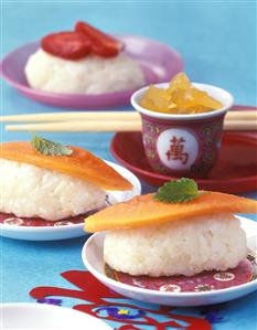 Fusion food: sweet rice sushi and candied ginger cubes