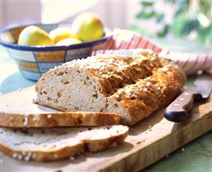Cinnamon apple stollen, pieces cut on wooden board