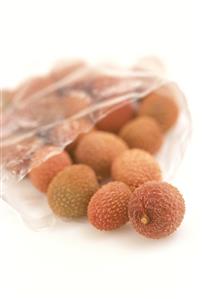 Fresh lychees in a transparent bag