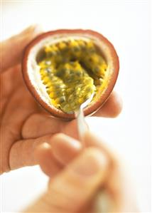 Scraping the flesh out of a maracuja