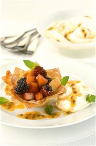 Filo pastry with apple & berry filling, cream & maracuja sauce