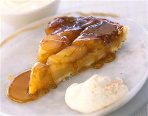 Piece of tarte tatin (caramelised apple tart) & cinnamon cream