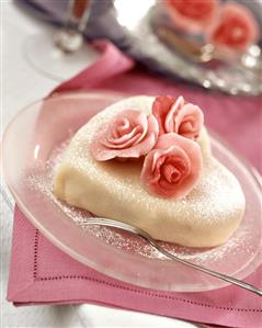 Heart-shaped cake with marzipan coating and marzipan roses