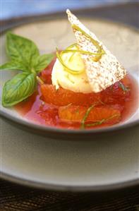 Citrus fruit soup with vanilla ice cream