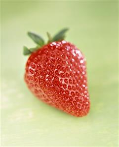 Strawberry on green background