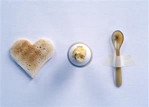 Breakfast setting with toast, egg and horn egg spoon