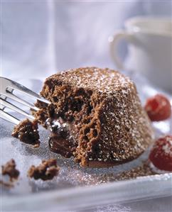 Fork sticking out of mini chocolate cake