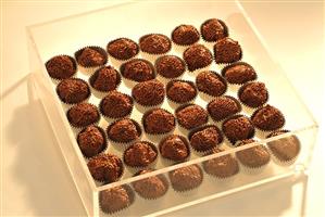 Brigadeiros in a perspex box