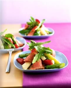 Asparagus salad with strawberries and duck breast