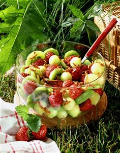 Strawberry & kiwi fruit salad with honeydew melon & almonds