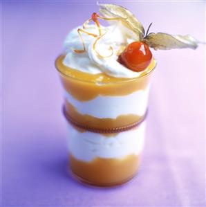 Layered dessert with mango and cream mousse