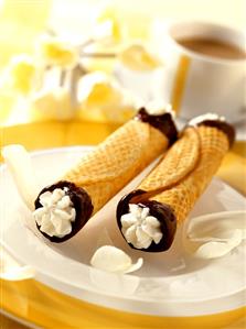 Two cannelons (wafer rolls filled with cream)