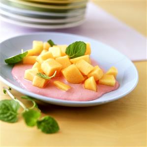 Cantaloupe melon with raspberry sauce