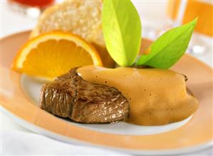 Steaks of young venison with stout zabaione and oranges