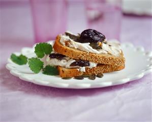 Mixed grain bread with plum quark and pumpkin seeds