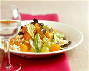 Brown rice with pumpkin, grapes and pumpkin seeds