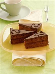 Three pieces of Sacher torte on platter