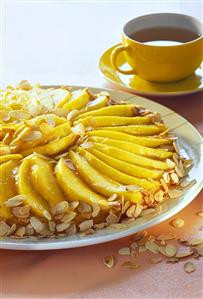 Mango cake with flaked almonds