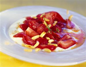 Cardamom yoghurt with strawberries and pine nuts