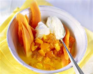 Papaya on kumquat compote with whipped cream