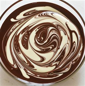 Dark and white chocolate sauce