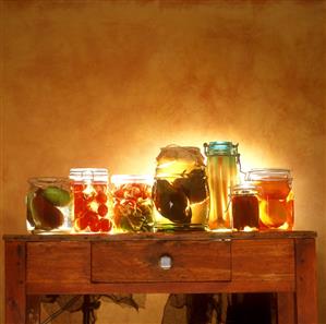 Bottled vegetables and bottled pears in jars