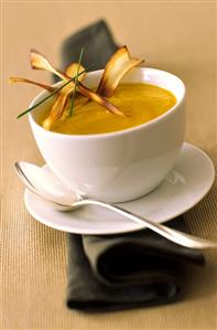 Pumpkin soup garnished with strips of deep-fried pumpkin