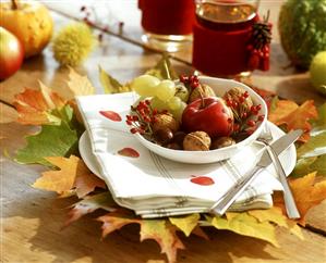 Autumnal fruit bowl on hand-printed linen cloths