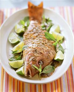 Platter of red snapper with tamarind puree and limes