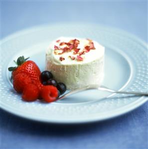 Vanilla ice cream with rose petals and fresh berries