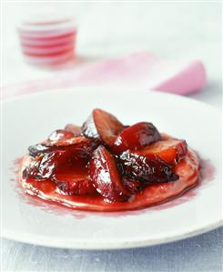 Small cake with caramelised plums