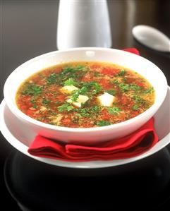 Clear tomato soup with pieces of tomato and tofu (1)