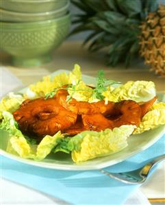 Fried bacon and pineapple on lettuce hearts