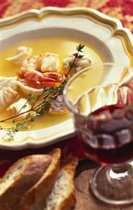 Clear fish soup with toasted bread