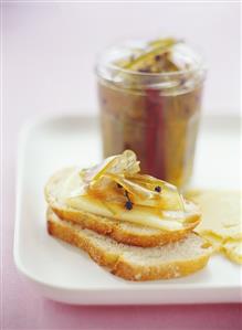 Pickled watermelon rind with Cheddar cheese on white bread