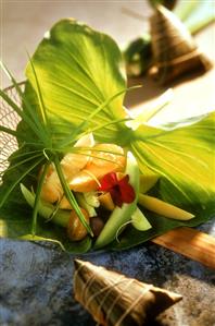 Exotic fruit salad on banana leaf